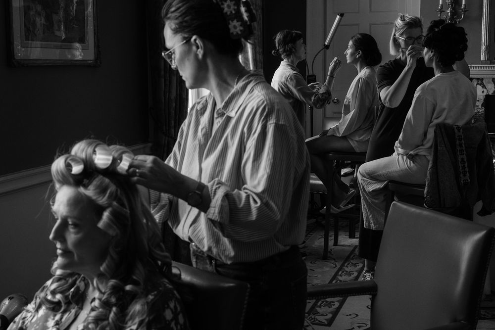 A black and white photo montage showing people in a nursing home setting with various daily activities and interactions.
