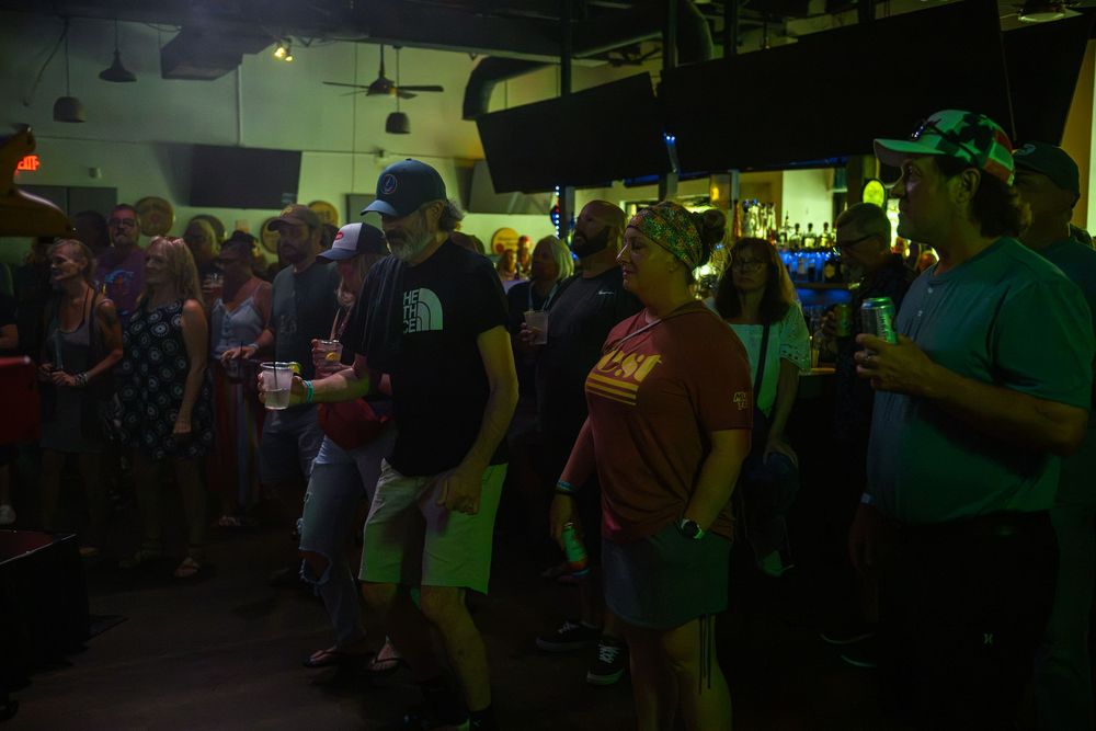 dancing at a concert indoors at Coastal Taproom
