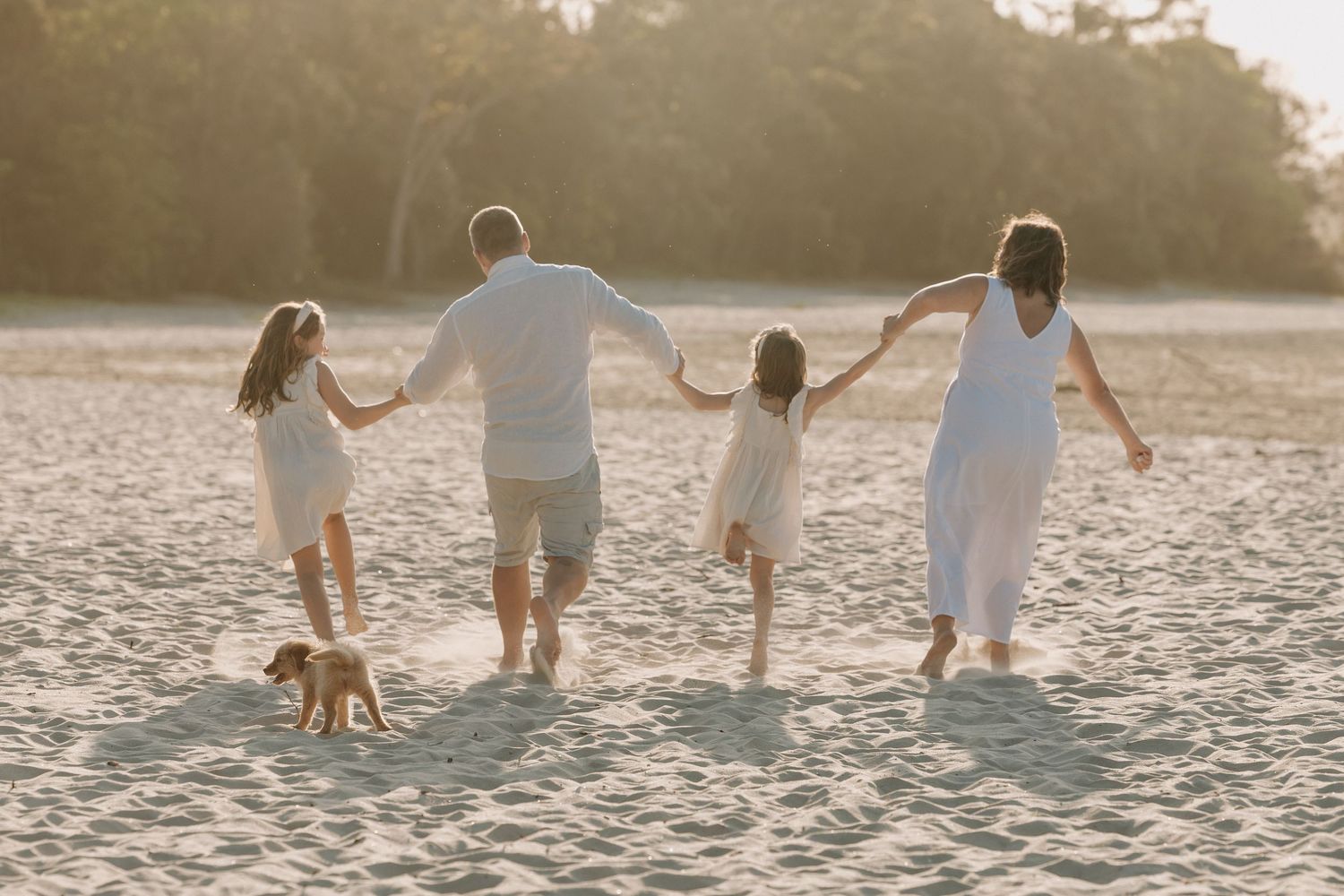 Sunset golden hour family photography session overlooking the beach at Noosa on the Sunshine Coast.