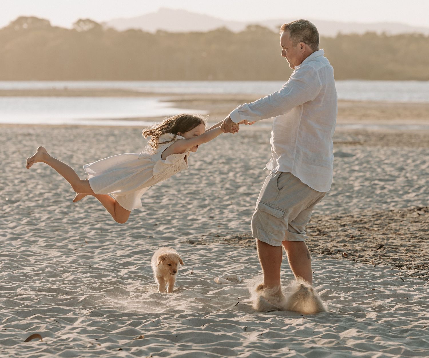 Sunset golden hour family photography session overlooking the beach at Noosa on the Sunshine Coast.