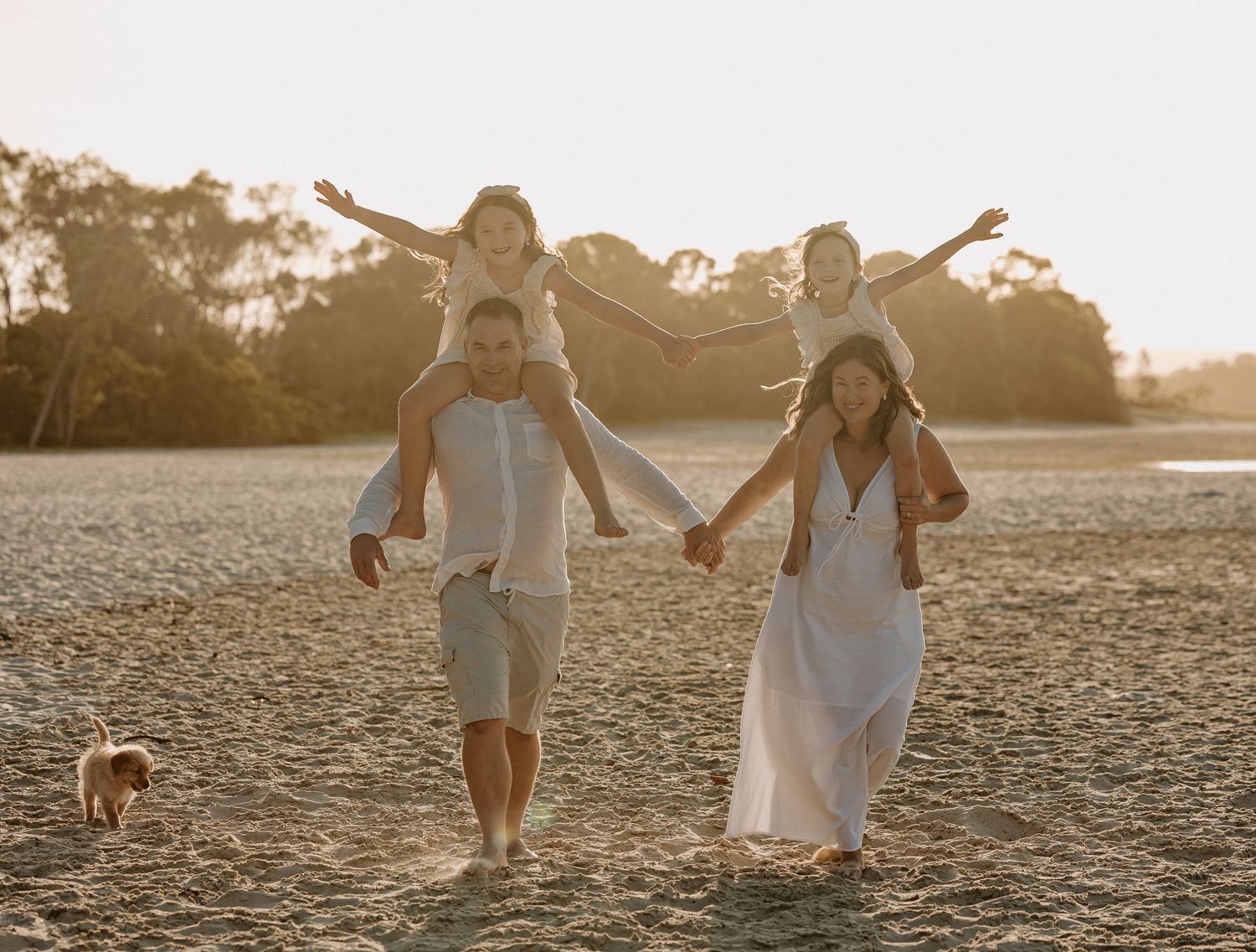 Sunset golden hour family photography session overlooking the beach at Noosa on the Sunshine Coast.
