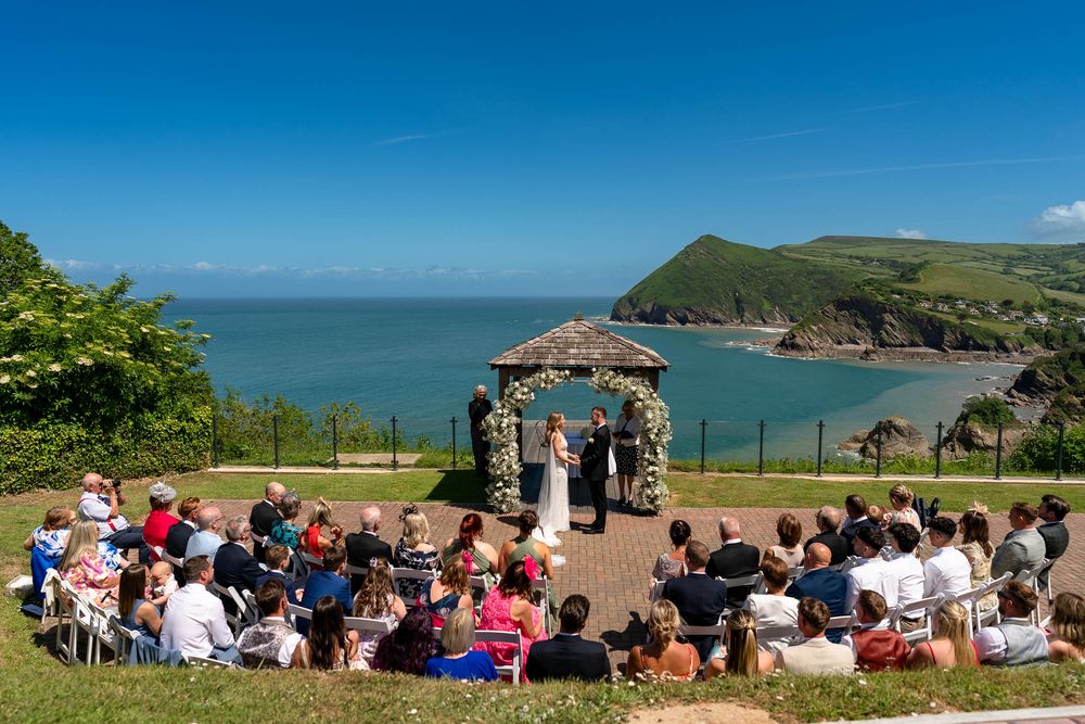 Guests watching the outdoor Wedding ceremony at Sandy Cove Hotel in Devon
