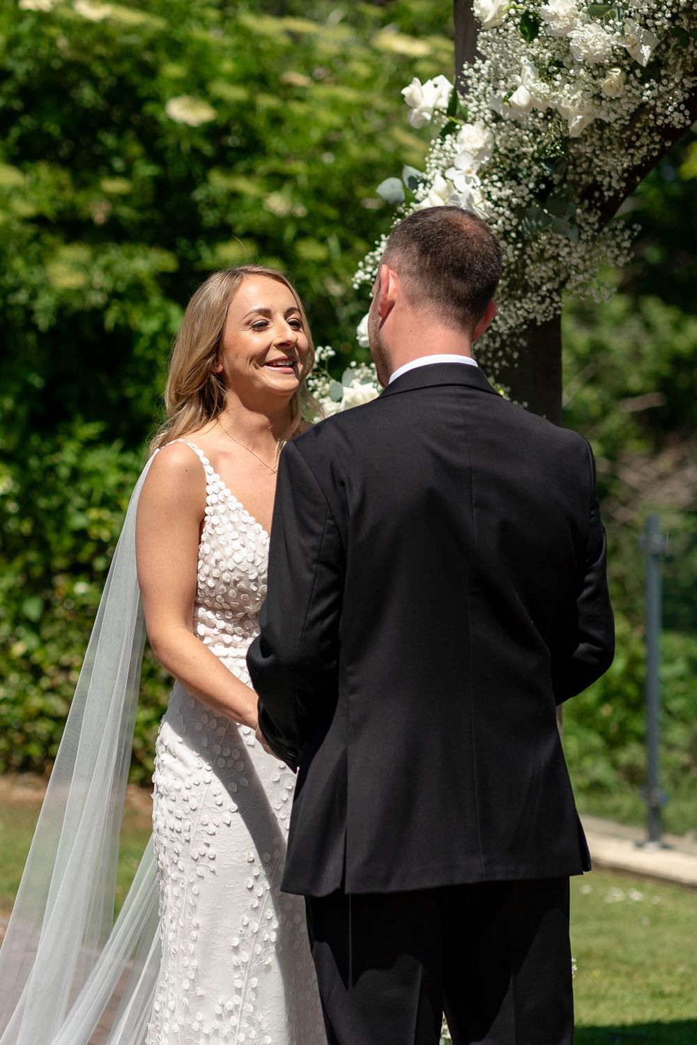 Bride and Groom during their seaside ceremony in Devon at Sandy Cove
