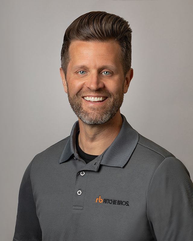 Professional team headshot for Ritchie Bros. Auctioneers, clean and consistent branding