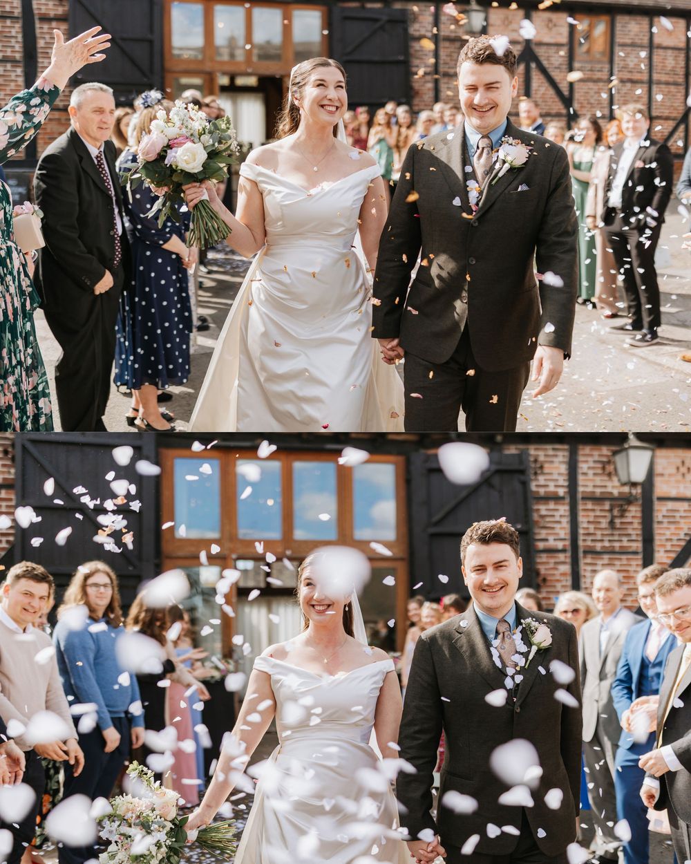 Newlywed couple walks through confetti shower with wedding guests cheering outside a rustic venue.