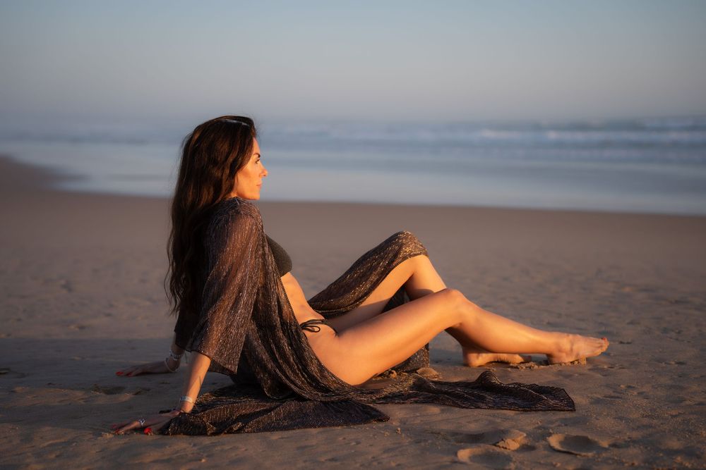 woman sitting on the beach