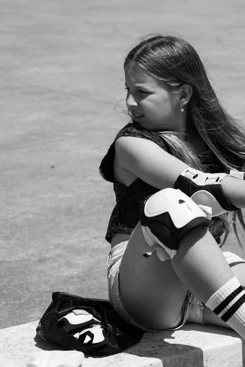Girl putting on roller-skates