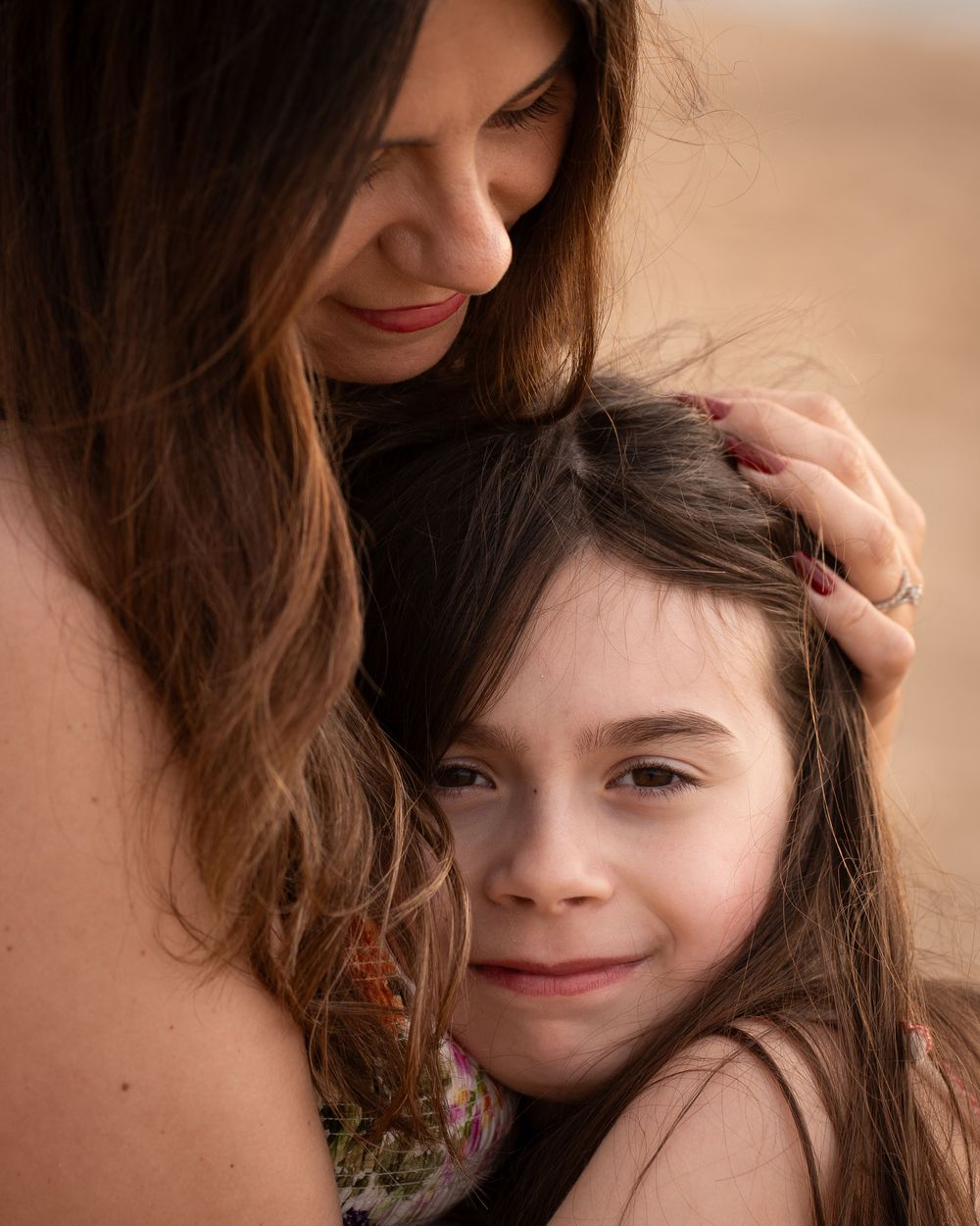 Mother and daughter hugging
