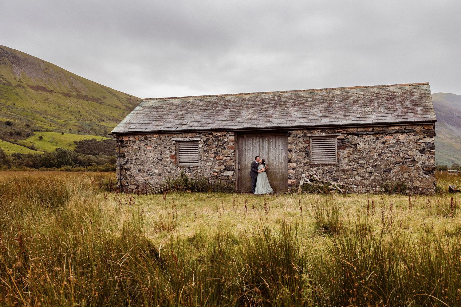 Natural wedding photography in the Lake District with mountain backdrop