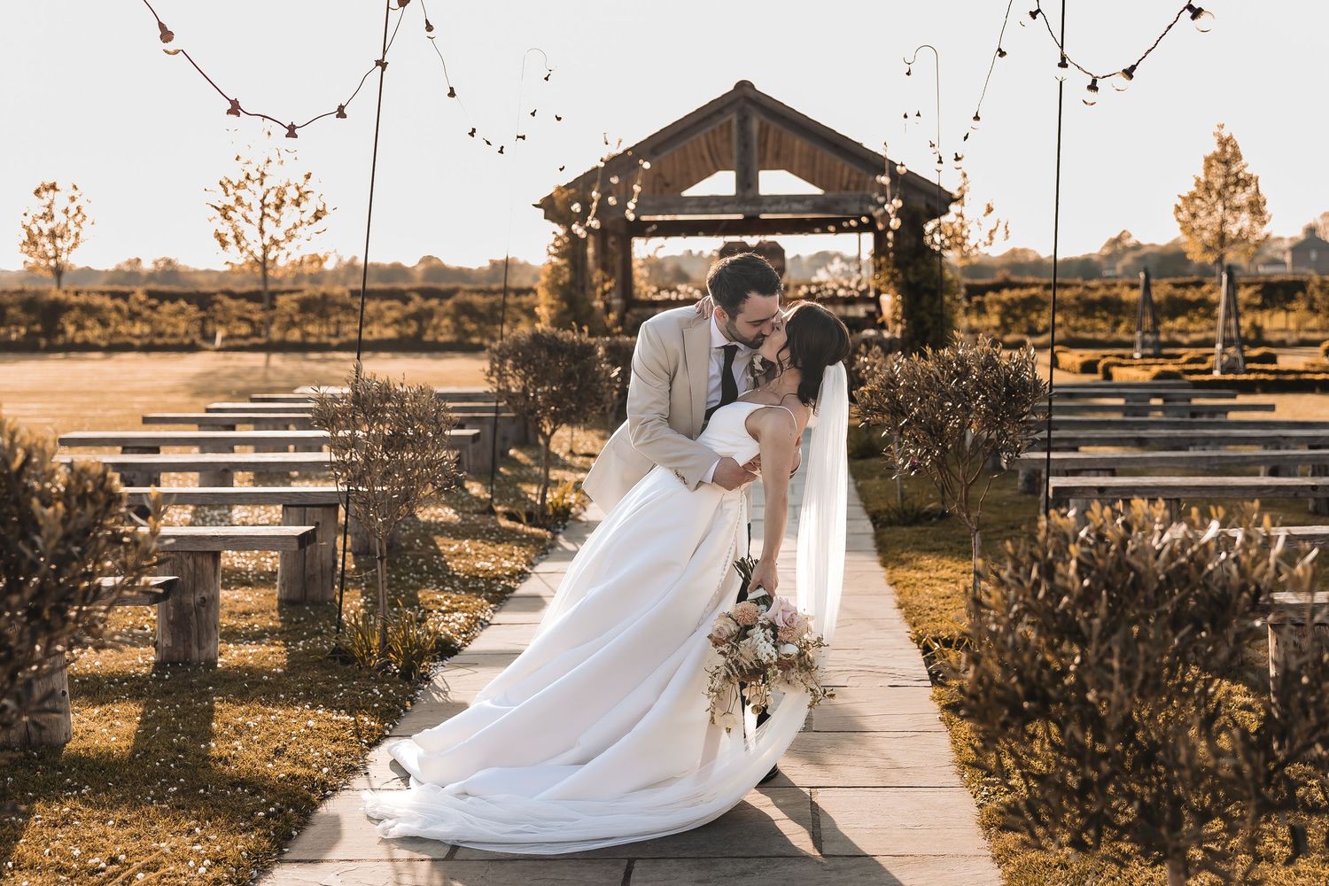 wedding couple dip kiss moment captured by a documentary wedding photographer.