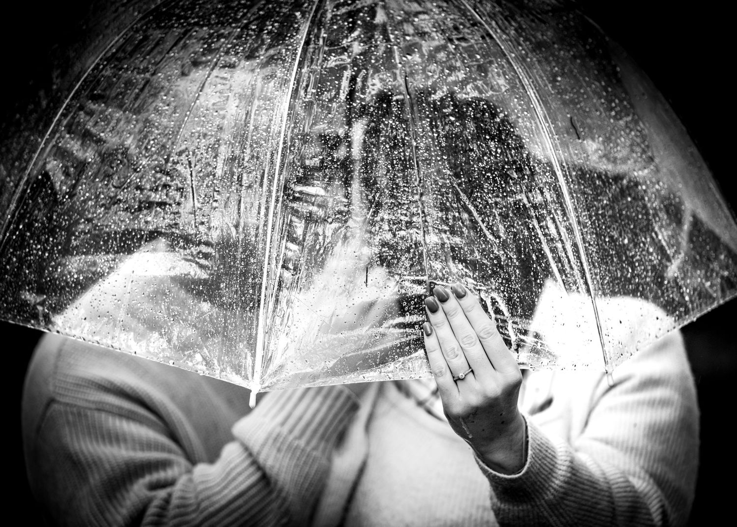 A series of black and white film photographs showing hands playing piano keys in dramatic lighting.