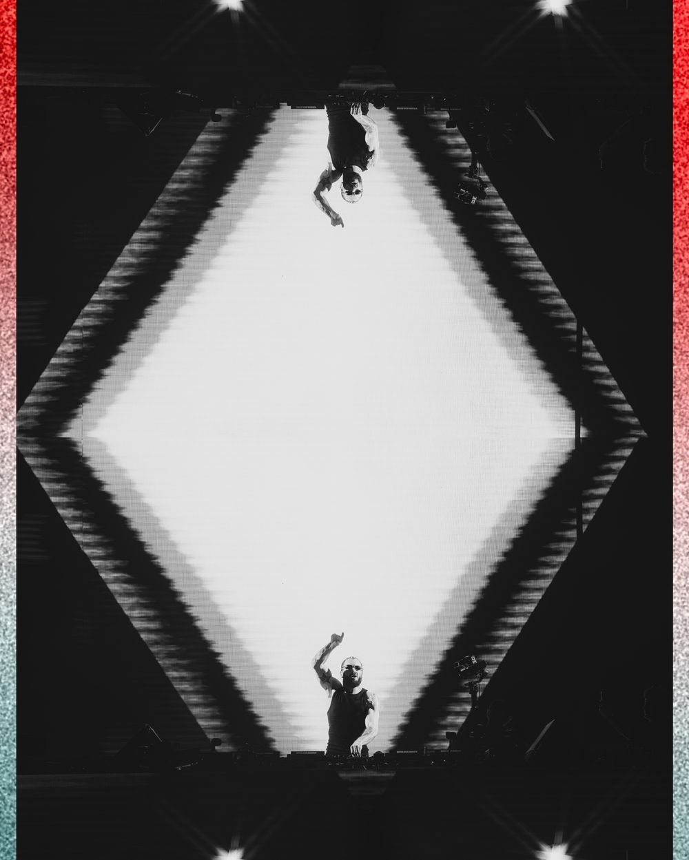 Black and white mirrored silhouette art of two figures in a geometric diamond shape creating a surreal symmetrical composition.