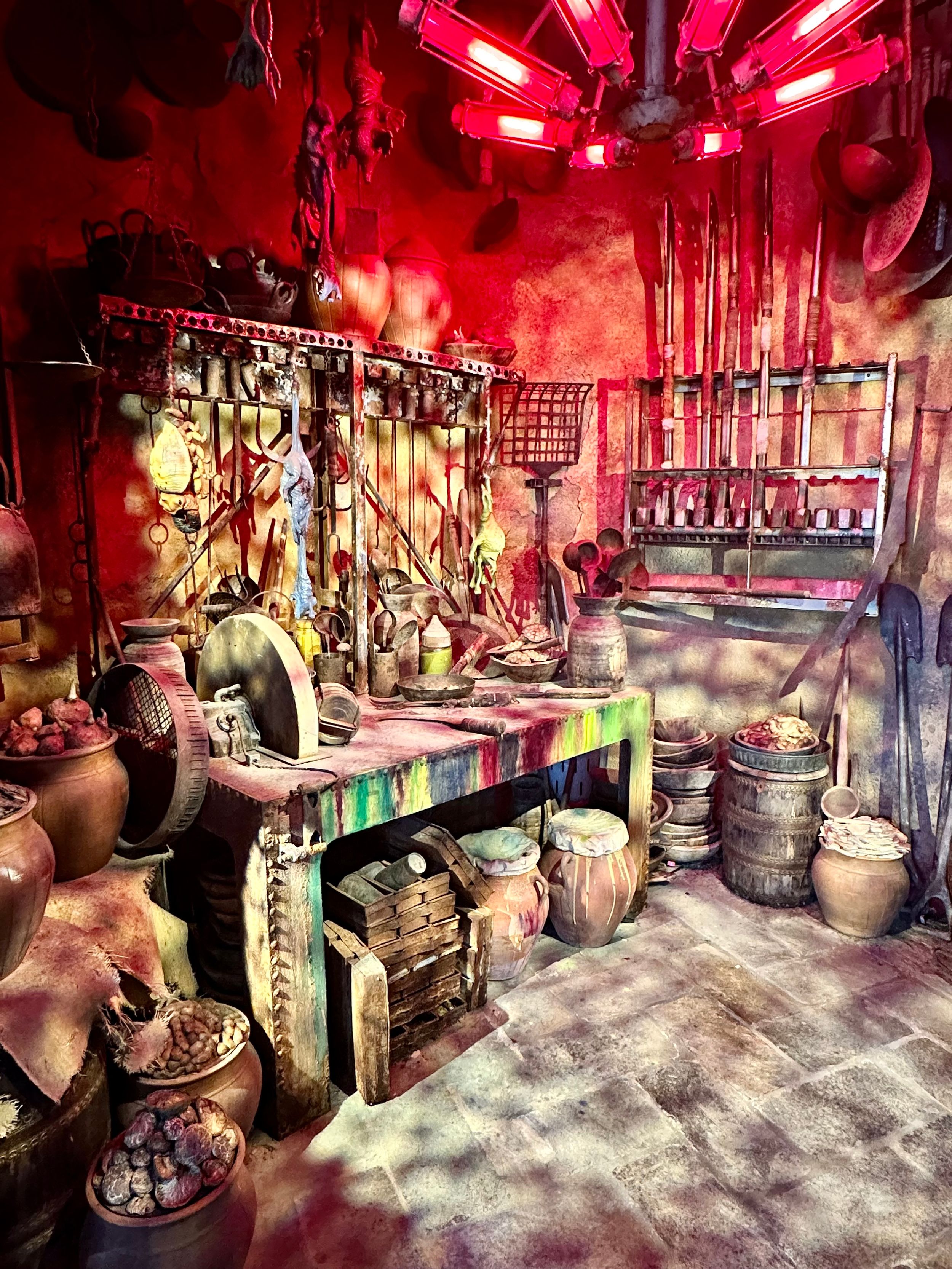 Immersive themed shop display with red lighting and mechanical props.