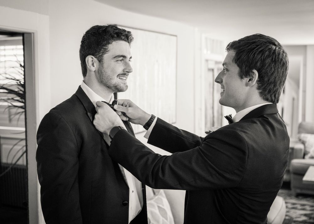 A sequence of photos showing two people in formal wear having an intense conversation during what appears to be a fight.
