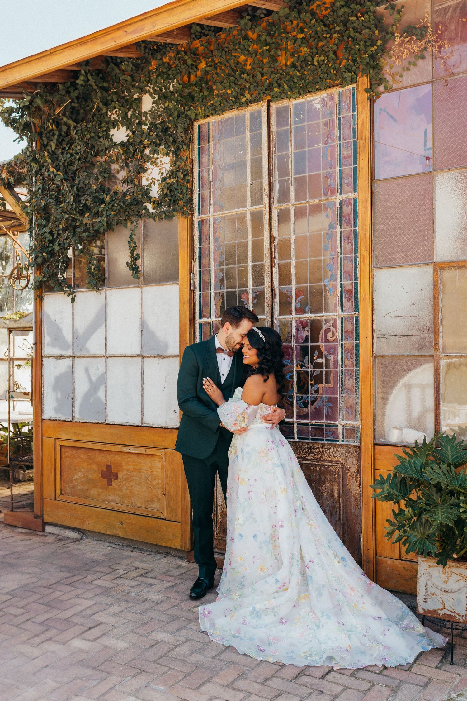Romantic wedding scene captured in a series of photos showing a couple in formal attire standing before glass windows at Race and Religious