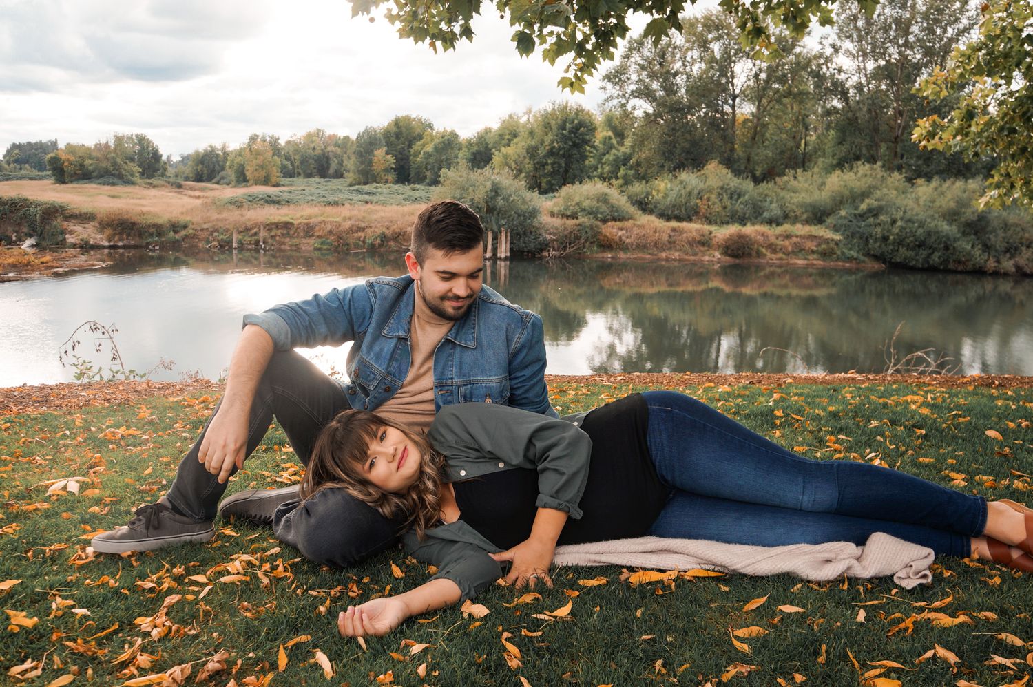 Couple laying down and posing during Maternity Session in Salem OR