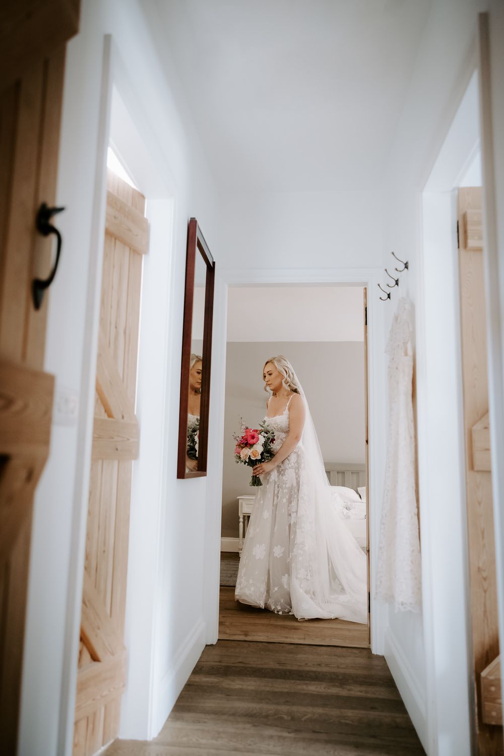 A sequence of images showing a bride in a white wedding dress standing at the end of a long hallway.