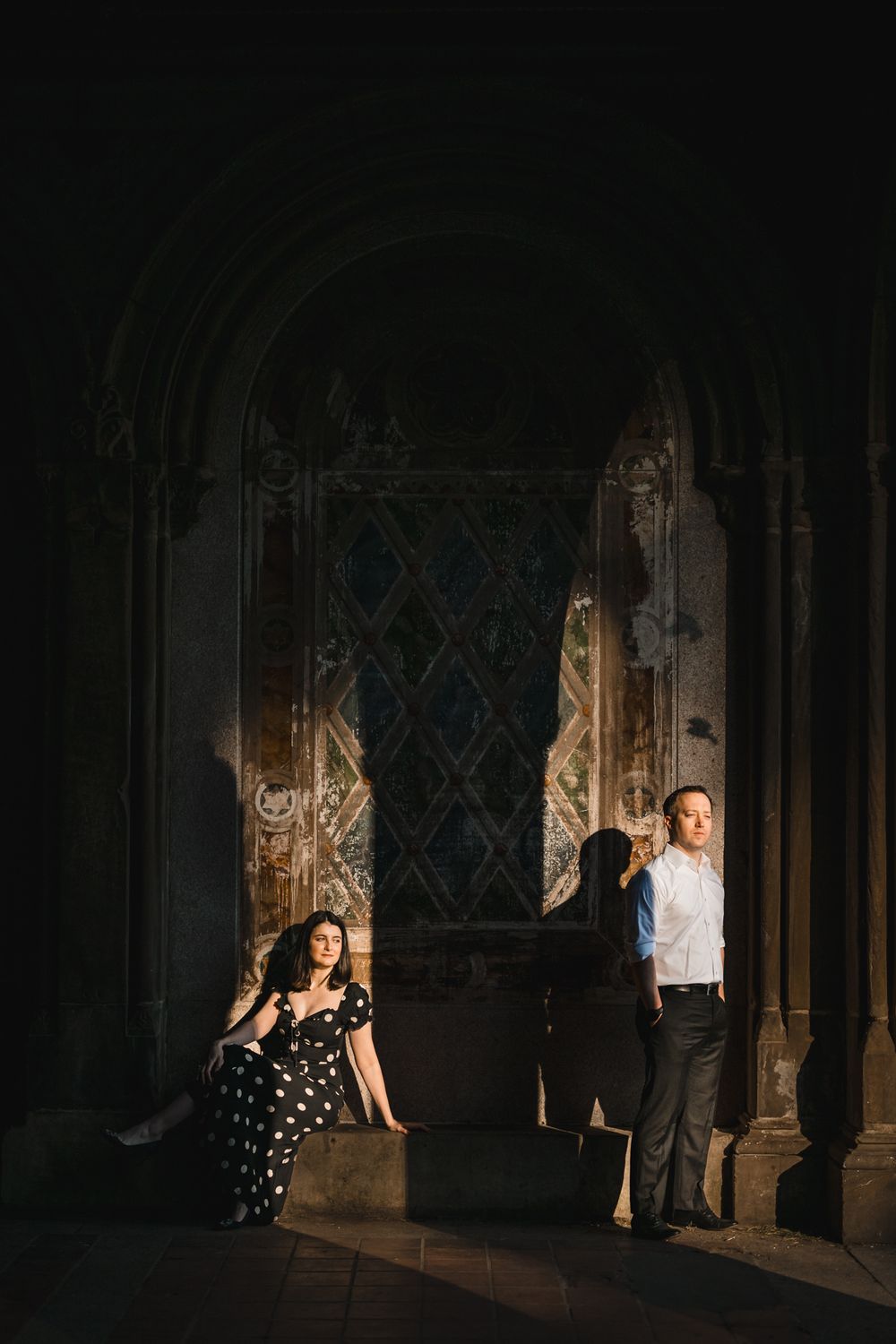 Artistic black and white photos captured in a Gothic architectural setting with dramatic shadows.