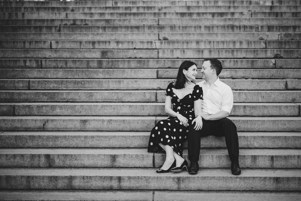 Series of intimate black and white photos on stone steps showing different romantic poses.
