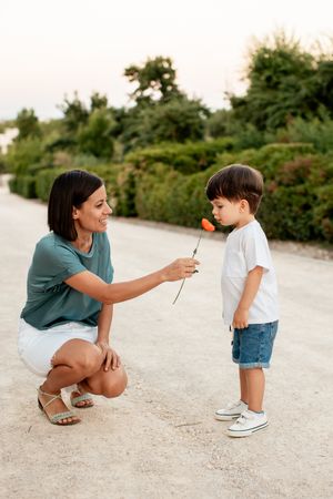 A tender moment shared between parent and child on a peaceful walking path.