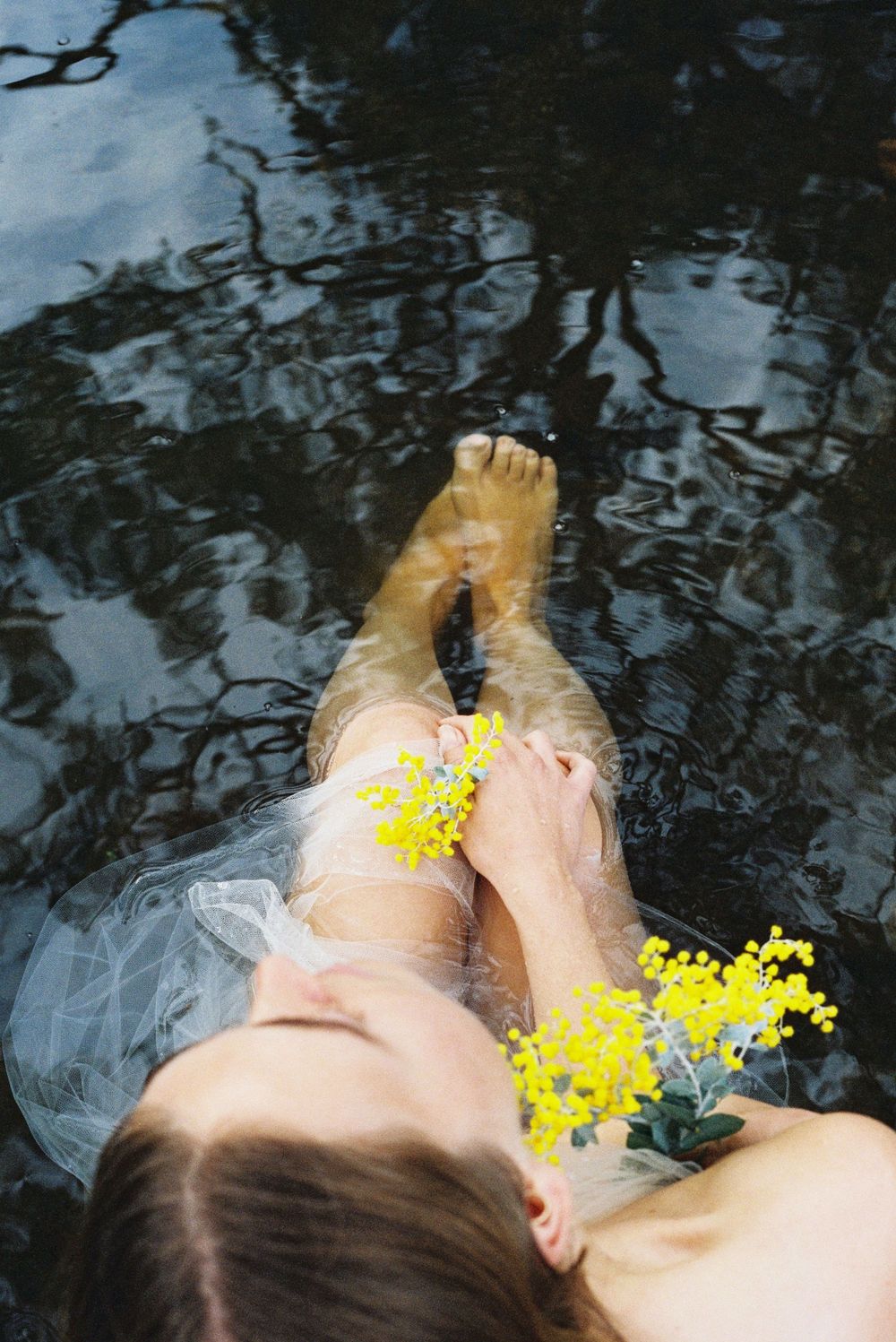 Soft tulle and wildflowers in water – slow, grounded branding image captured on film in Western Australia