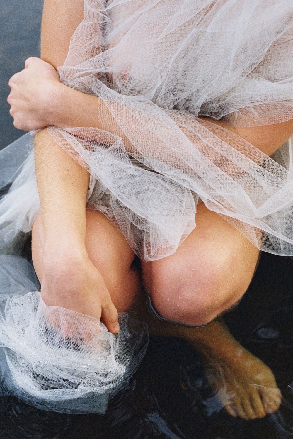 Soft tulle and wildflowers in water – slow, grounded branding image captured on film in Western Australia