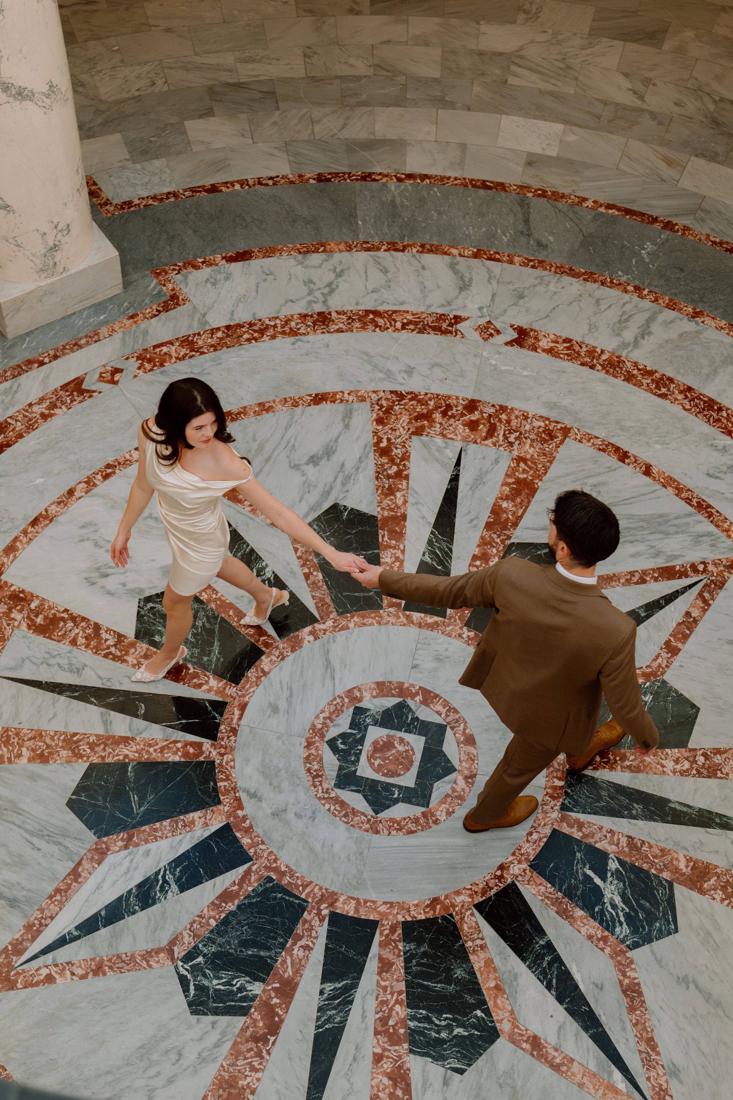 Couple dances gracefully on ornate marble floor with geometric pattern in multiple connected photos.