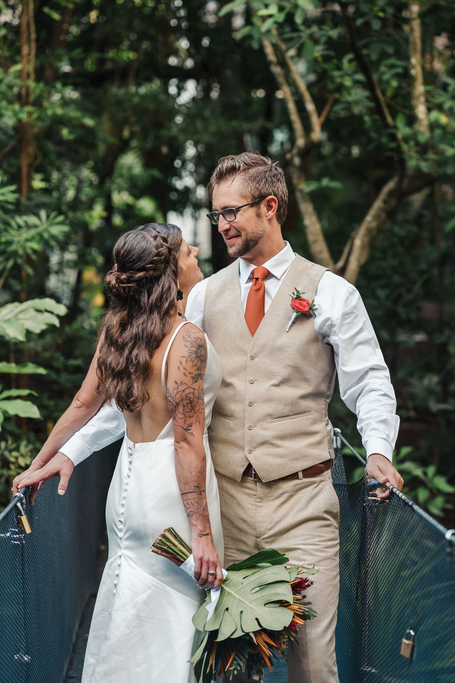 Intimate wedding moment between couple in rustic garden setting with tropical greenery,Sandos Caracol Wedding.