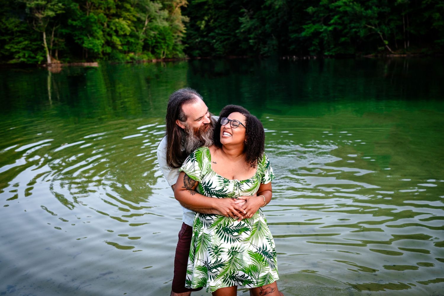 Couple Smiling in the lake after he proposed