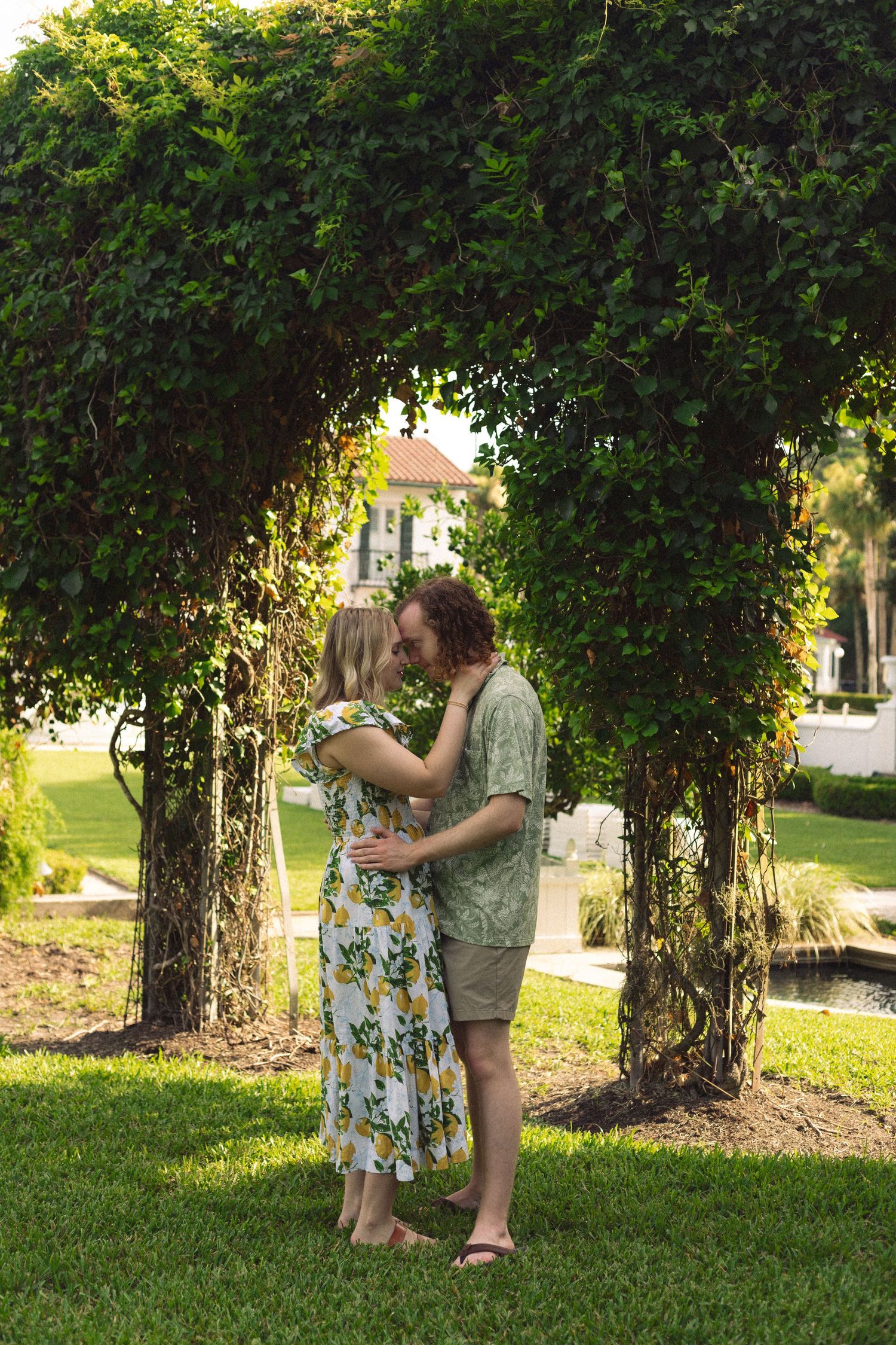 Mother and daughter sharing tender embrace in forest setting.