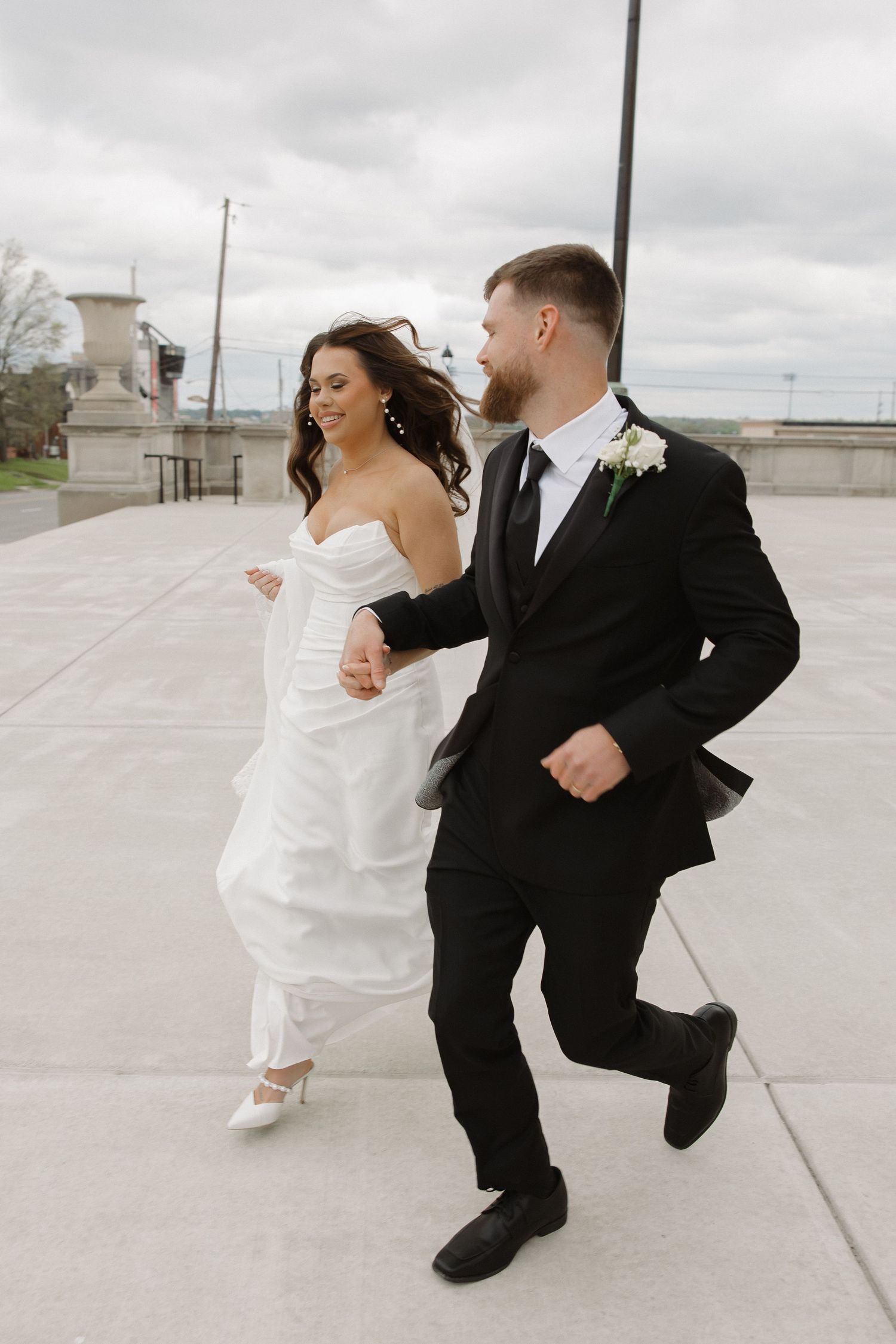 An intimate wedding moment captured during golden hour with fall foliage in the background.