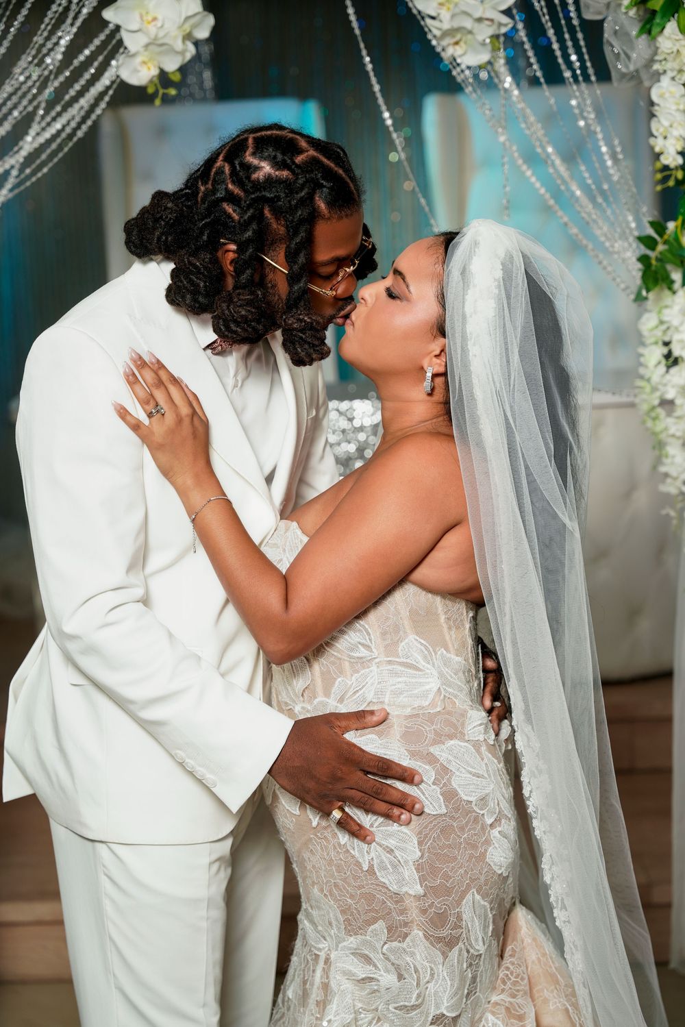 A romantic wedding moment captured in sequence as a couple shares their first kiss as newlyweds.