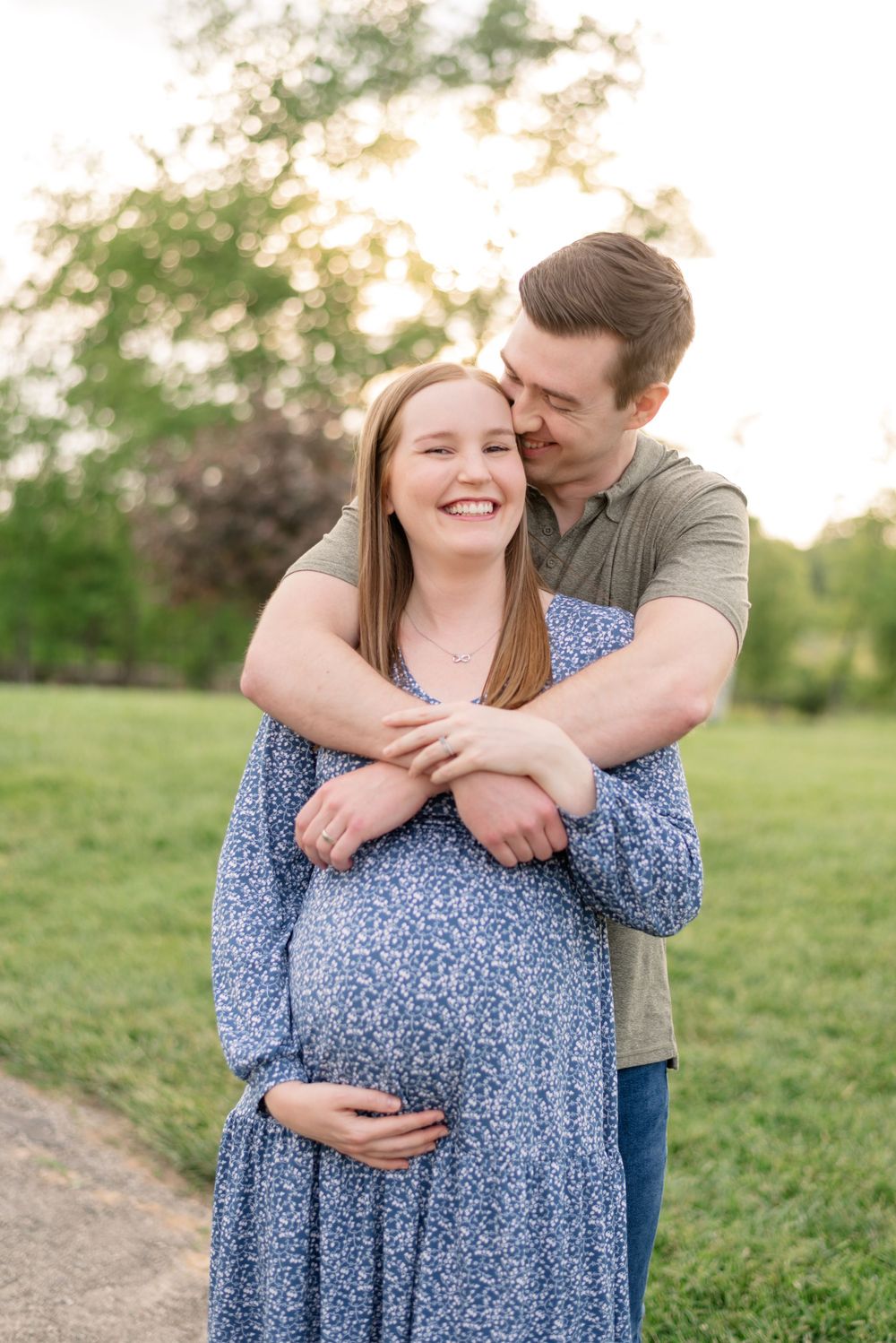 soon to be mom hugged by partner