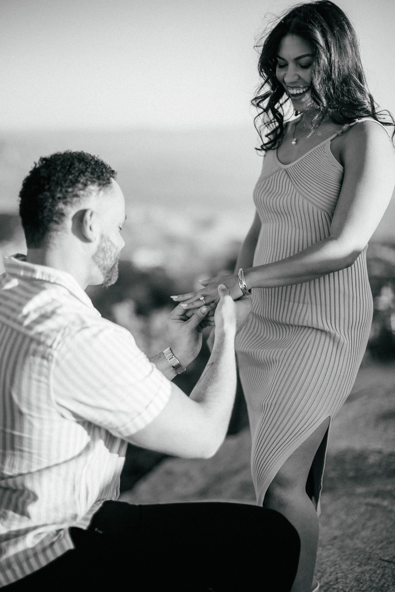 A romantic black and white maternity photoshoot sequence showing tender moments between a couple.