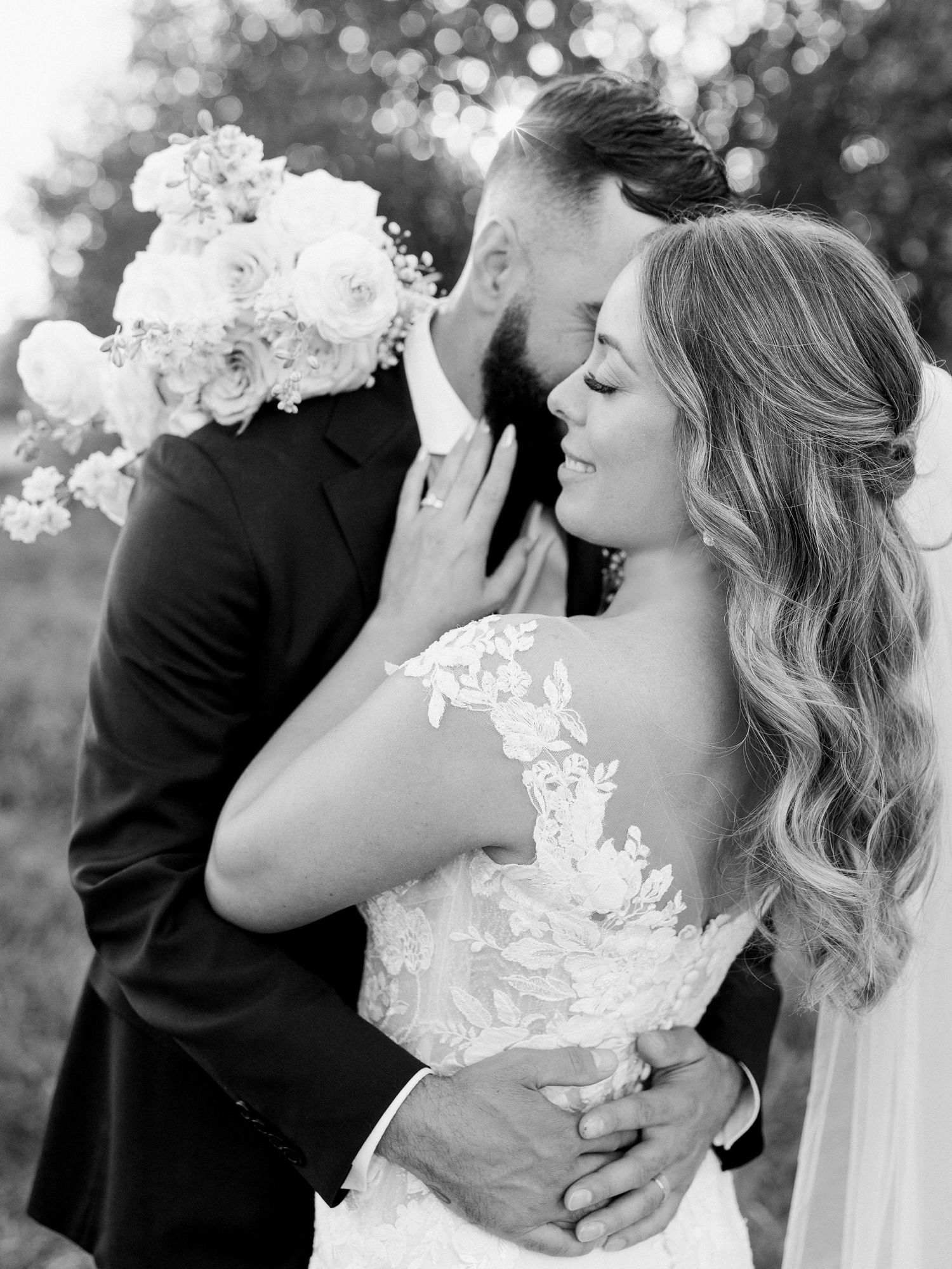 Black and white romantic wedding portraits showing intimate moments between newlyweds.