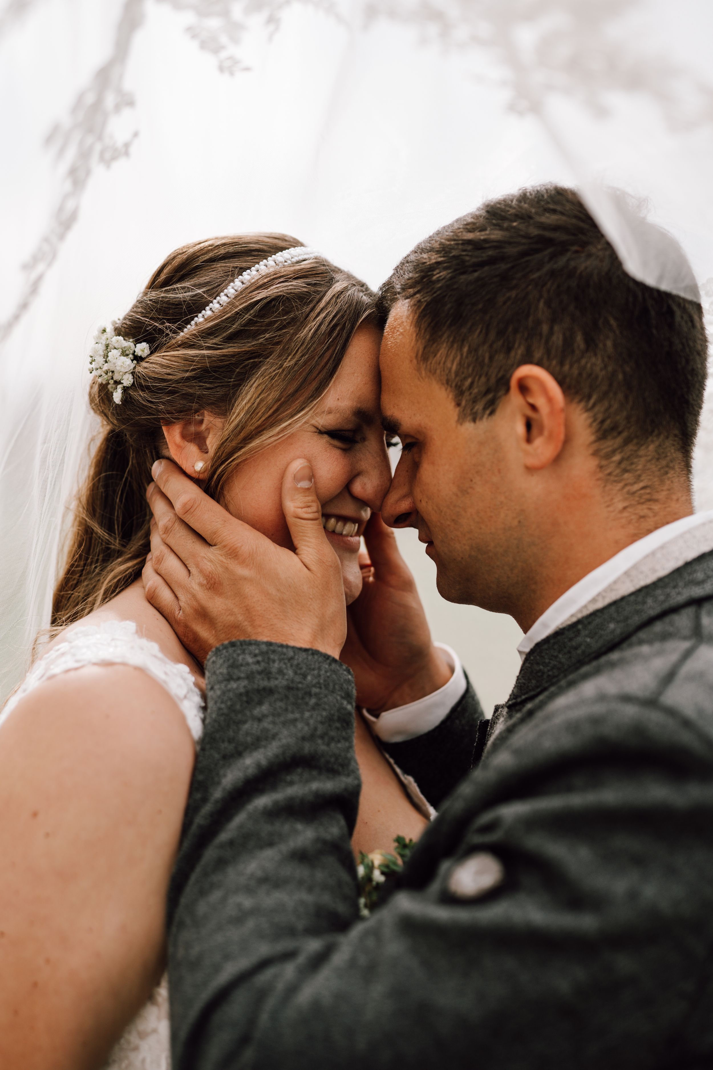 Intimate close-up of a tender moment between newlyweds.