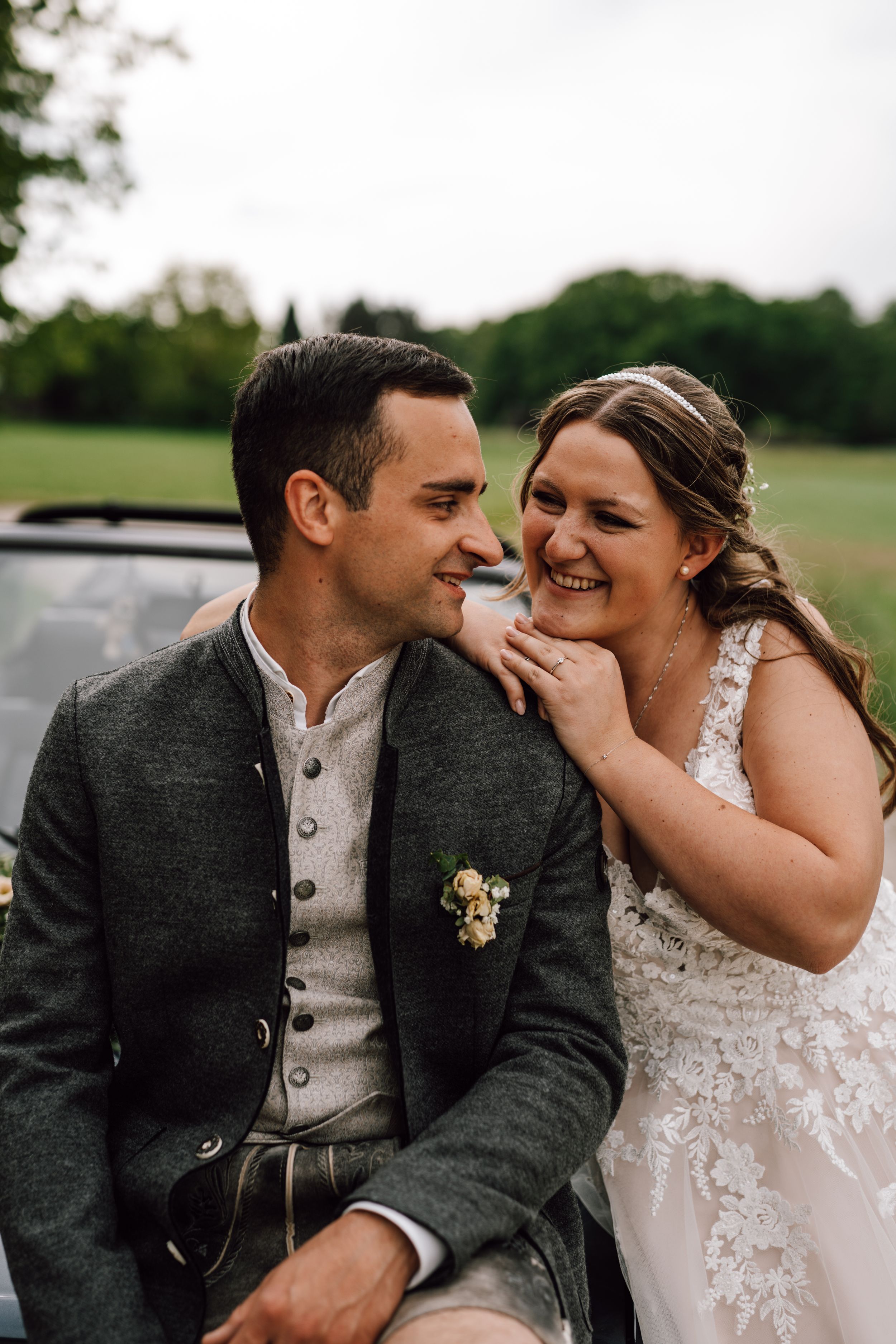 Romantic wedding couple shares intimate moments in a series of candid outdoor portraits.