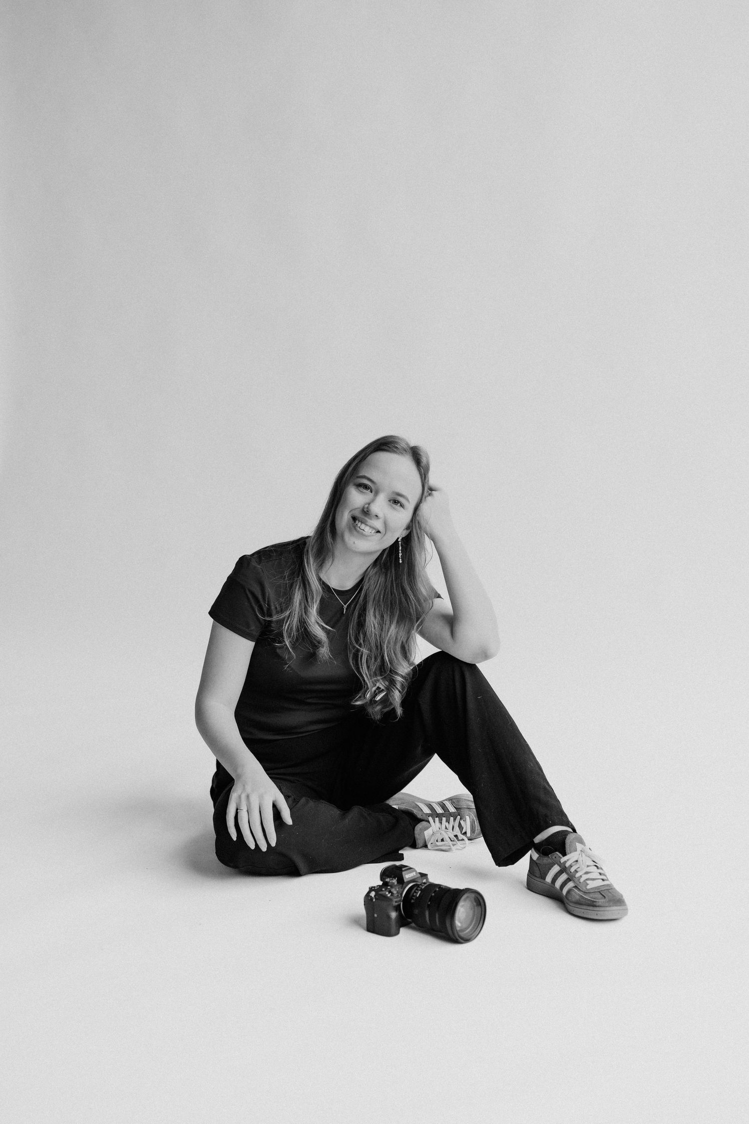 Bryllupsfotograf og familiefotograf tager billede af sig selv