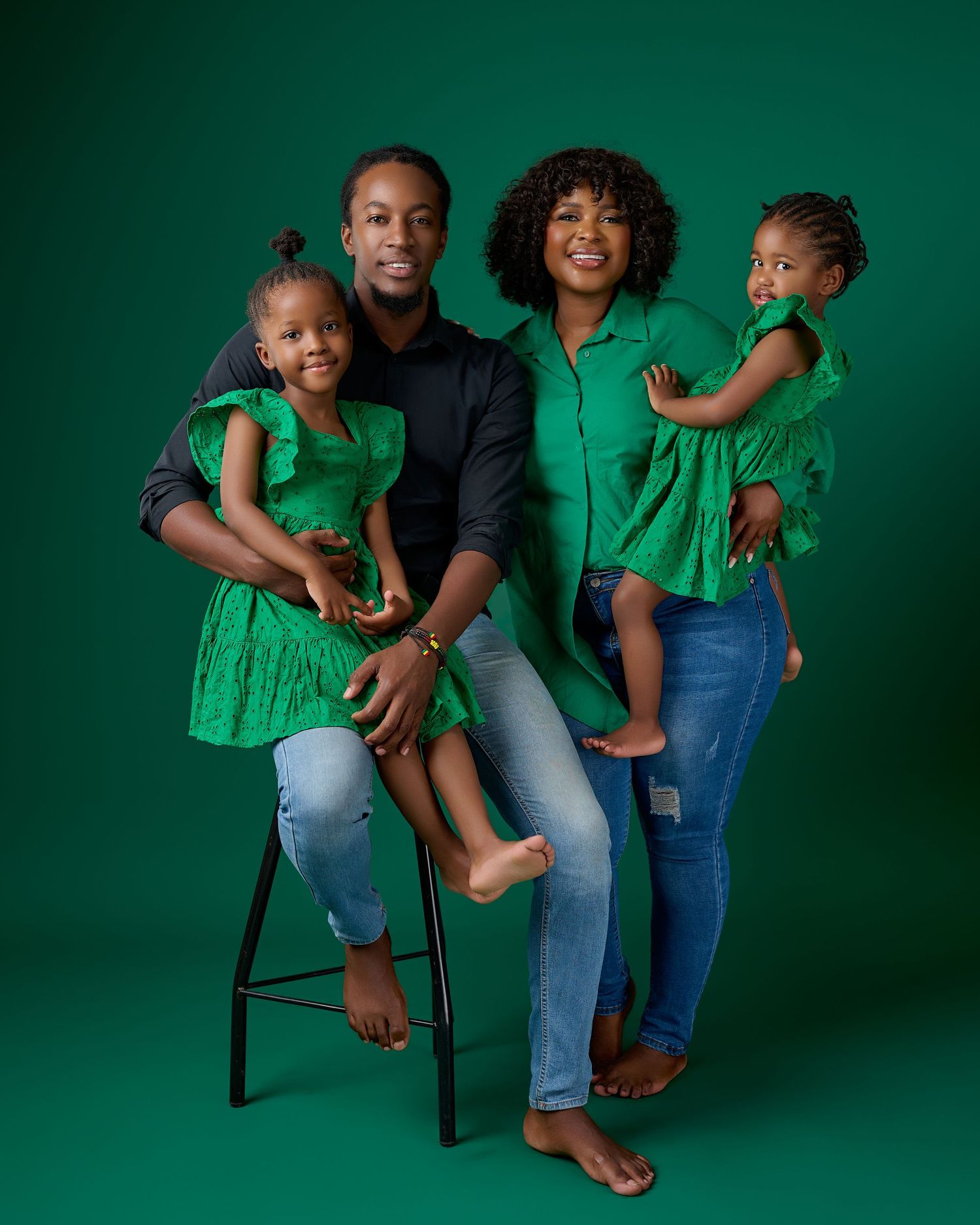 family in green posing