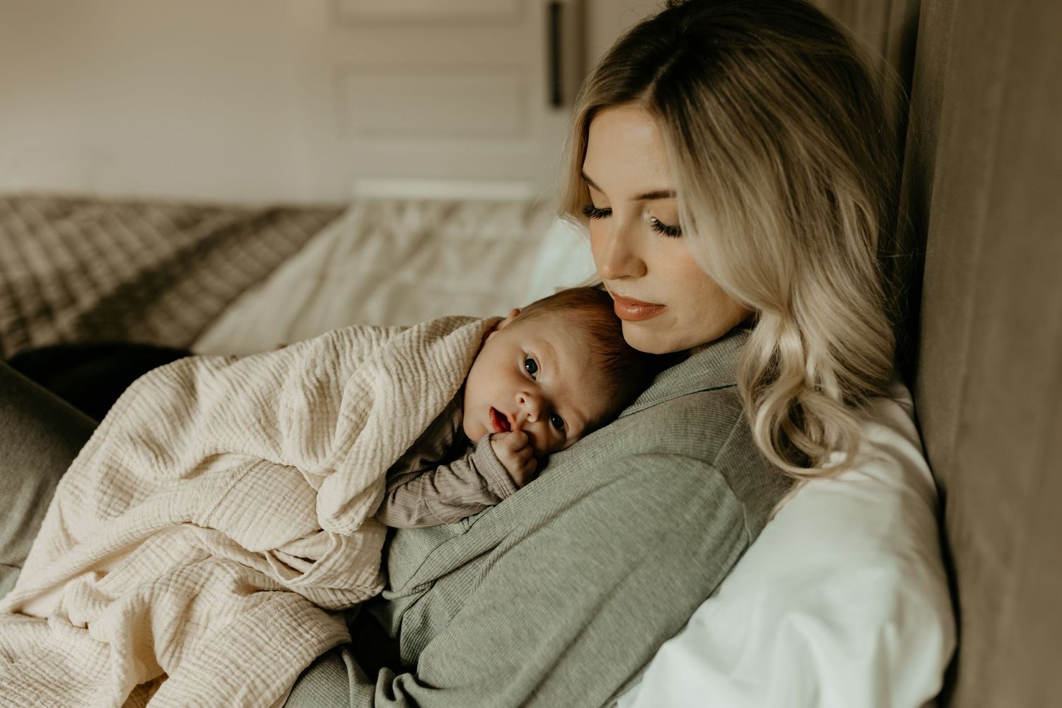 Dreamy lifestyle photos show someone sleeping peacefully in soft white bedding with natural morning light.