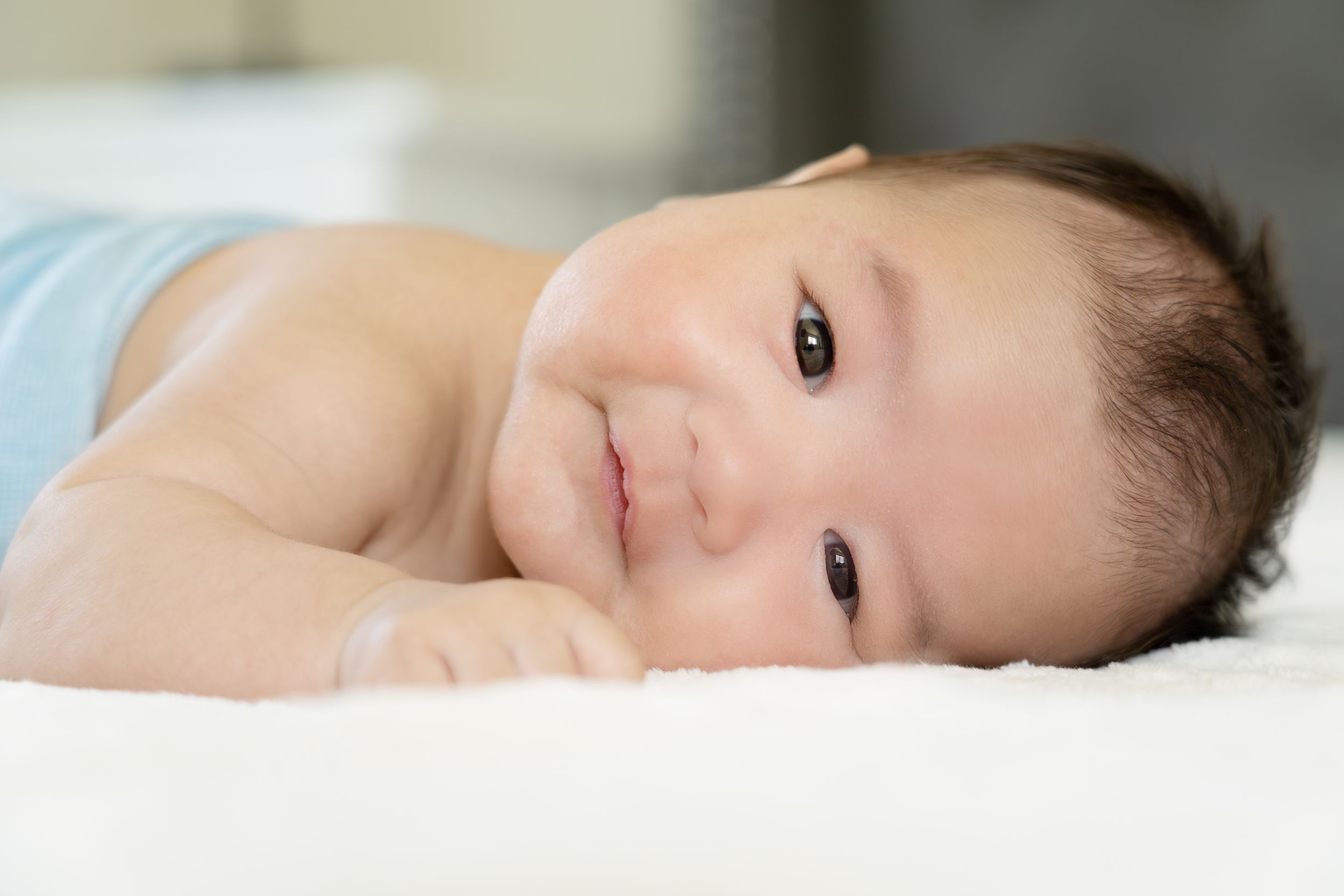 Close-up portrait of a sleeping baby with soft natural lighting.