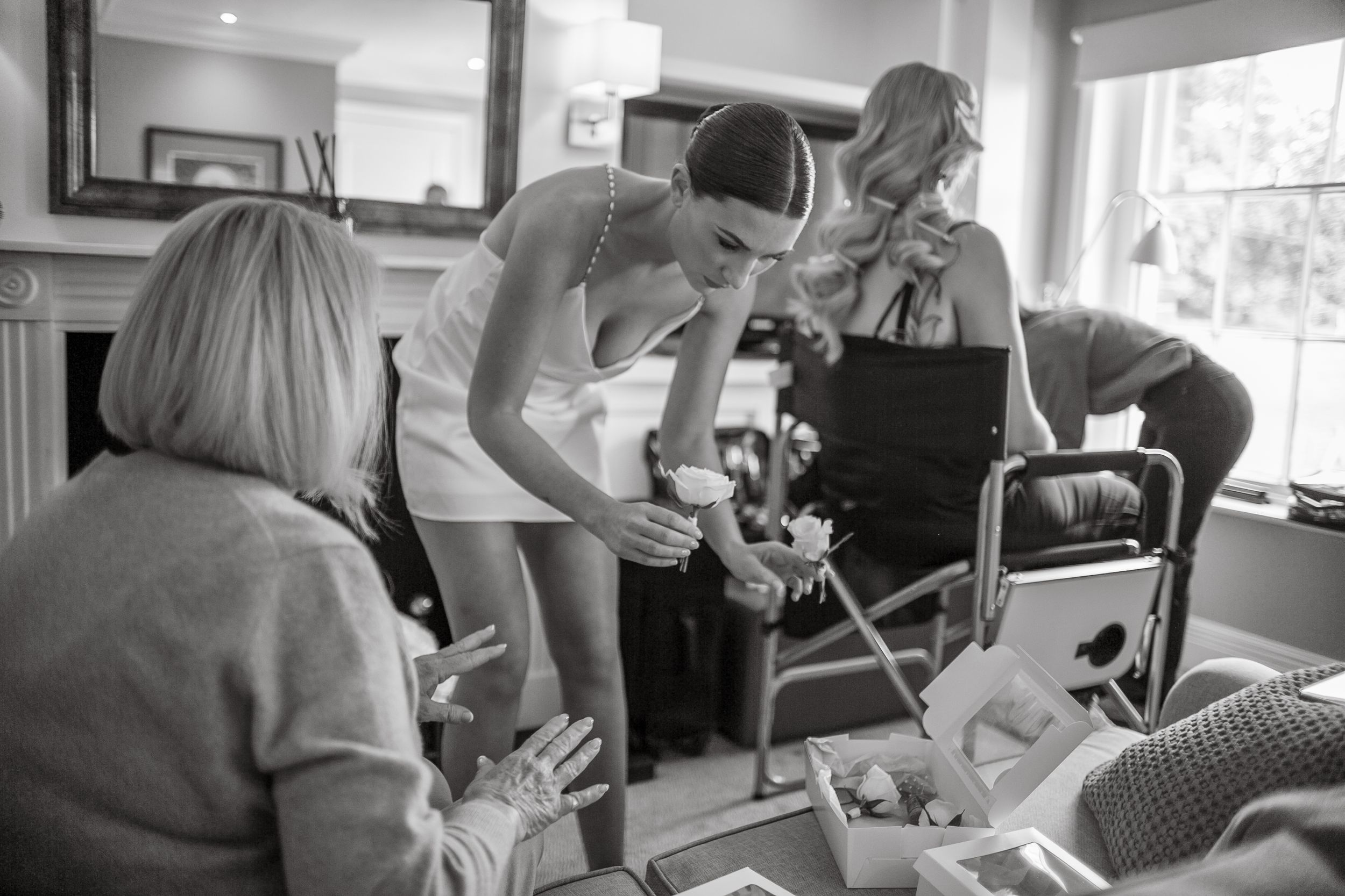 Intimate gathering of people in a home setting sharing a special moment.