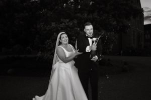 Outdoor wedding photography capturing joyful moments between the newlyweds.