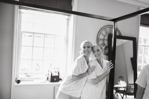 Candid black and white getting ready moments before the wedding ceremony.