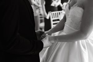 Elegant wedding ceremony moments captured in natural outdoor setting.