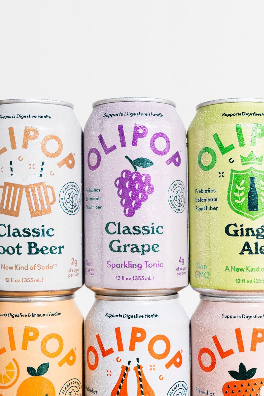 Colorful array of Olipop sparkling tonic cans featuring different flavors and retro-style designs.