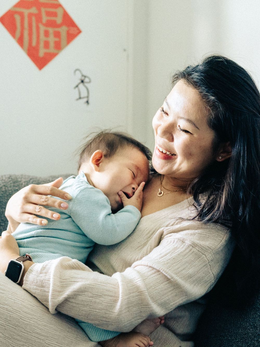 A tender moment shows a parent and child embracing and laughing together on a couch in a series of candid shots.