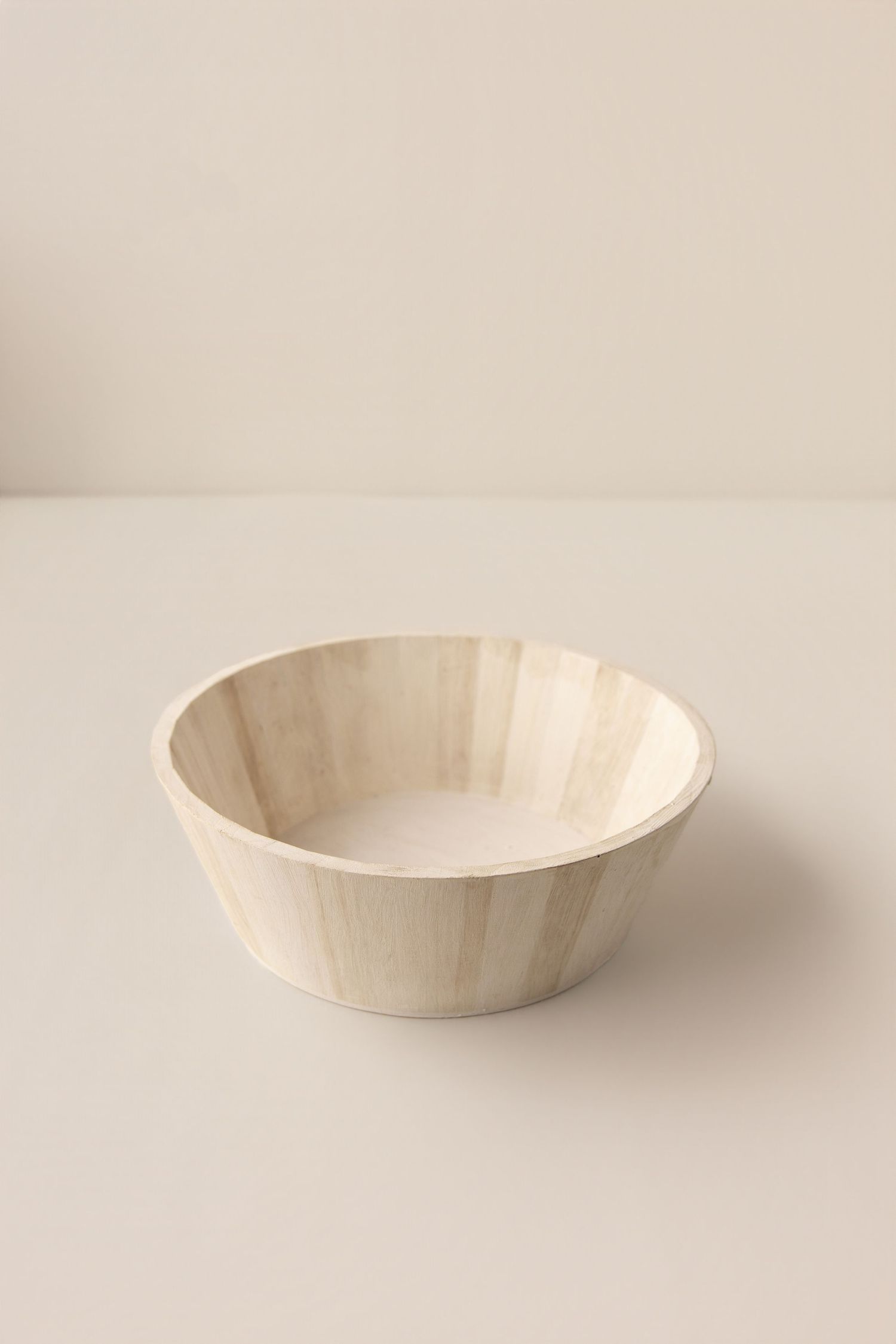 Light wood grain bowl with fluted sides, natural finish, minimalist design, perfect for serving salads or snacks.
