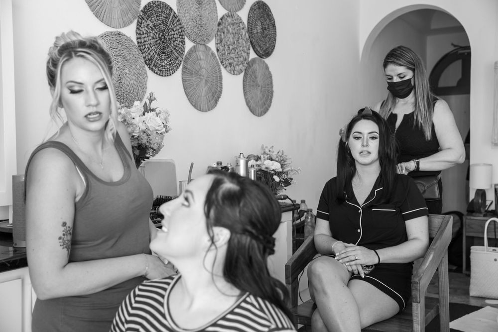Wedding preparation scene with beauty styling in progress.