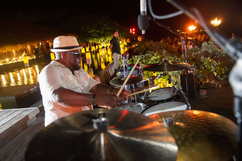 Drummer playing poolside at an evening party at Engage Luxury Wedding Summits at the Nizuc Resort and Spa Cancun, Mexico